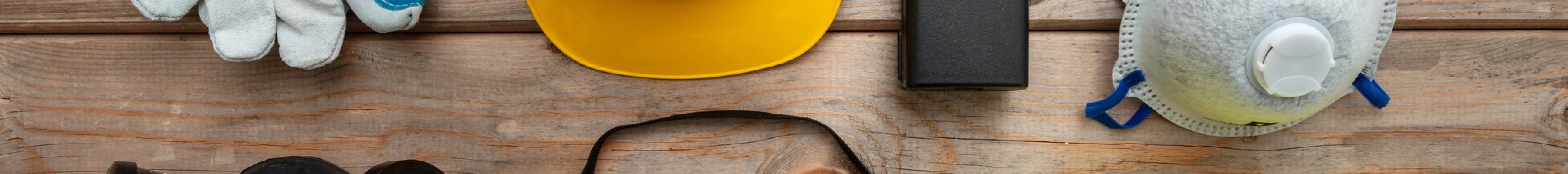 Work safety protection equipment. flat lay on wooden background.